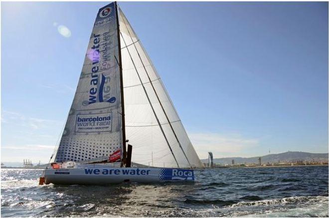 We Are Water - skippers Bruno and Willy Garcia crossing the finish line in fifth place - Barcelona World Race 2015 ©  Mireia Perello